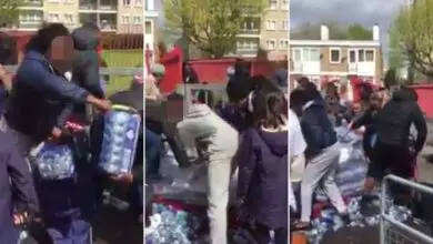 People Stealing Drinking Water at a Marathon