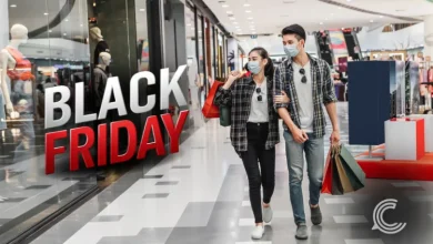 Shoppers browsing discounted products during Black Friday as footfall declines.
